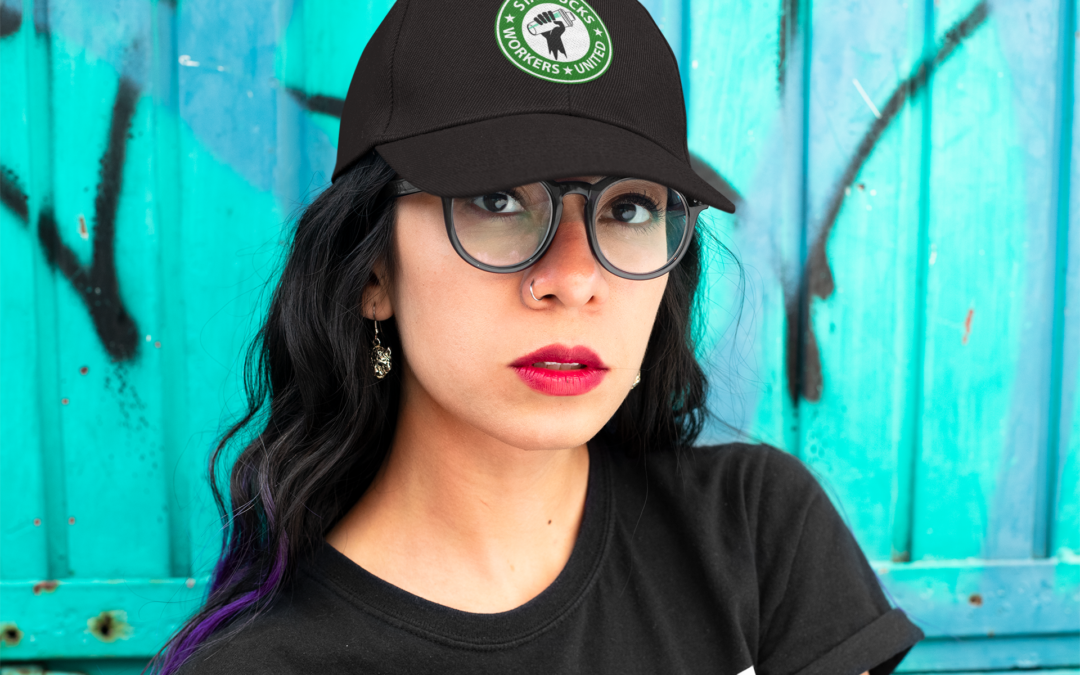 Woman wearing Starbucks Workers United union made hat